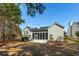 Rear exterior view showcasing the home, outdoor patio and porch with a view to the backyard at 2176 Andover Way, Mount Pleasant, SC 29466