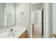 Neutral bathroom with white countertop, tiled floors, vanity, faucet, mirror and open doorway at 2176 Andover Way, Mount Pleasant, SC 29466