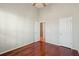 Hardwood floor bedroom with ceiling fan, two closets, and an open entry doorway at 2176 Andover Way, Mount Pleasant, SC 29466