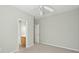 Neutral bedroom with ensuite bathroom and hall closet, carpet, ceiling fan, and gray walls at 2176 Andover Way, Mount Pleasant, SC 29466