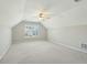 Bonus room with vaulted ceilings, neutral carpet, and a large window for natural light at 2176 Andover Way, Mount Pleasant, SC 29466