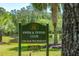 Elegant community sign for the Swim & Tennis Club amidst a serene park setting with beautiful green landscaping at 2176 Andover Way, Mount Pleasant, SC 29466