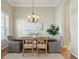 Formal dining room featuring a chandelier, stylish decor, and ample space for gatherings at 2176 Andover Way, Mount Pleasant, SC 29466