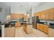 Spacious kitchen with stainless steel appliances, granite countertops, kitchen island and wooden cabinets at 2176 Andover Way, Mount Pleasant, SC 29466