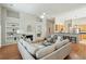 Open-concept living space with a fireplace, built-in shelves, and seamless flow to the kitchen area at 2176 Andover Way, Mount Pleasant, SC 29466