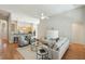Bright living room with hardwood floors, neutral paint, modern furniture, and open floor plan to kitchen at 2176 Andover Way, Mount Pleasant, SC 29466
