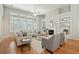 Spacious living room with built-in shelving, fireplace, and large windows, creating a cozy atmosphere at 2176 Andover Way, Mount Pleasant, SC 29466
