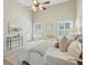 Bright and airy main bedroom with large windows, soft lighting, ceiling fan and neutral carpet at 2176 Andover Way, Mount Pleasant, SC 29466