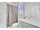 Clean bathroom with a shower/tub combo, gray vanity and neutral color scheme at 225 Bird Song Path, Summerville, SC 29485