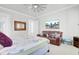 Inviting bedroom with a ceiling fan, comfortable seating, and an en-suite bathroom at 225 Bird Song Path, Summerville, SC 29485
