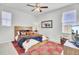 Stylized bedroom with a wood bedframe, neutral tones and a ceiling fan at 225 Bird Song Path, Summerville, SC 29485