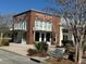 The Corner House Cafe offers a charming spot for coffee and information with a brick facade and awning at 225 Bird Song Path, Summerville, SC 29485