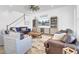 Inviting living room with a ceiling fan, hardwood floors, TV, and an open staircase at 225 Bird Song Path, Summerville, SC 29485