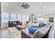 Spacious living room with abundant natural light and an open layout perfect for entertaining and relaxation at 225 Bird Song Path, Summerville, SC 29485
