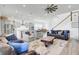 Open concept living room features comfortable seating and an open flow to the kitchen and dining area at 225 Bird Song Path, Summerville, SC 29485