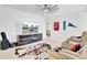 Spacious movie room featuring leather recliners, a large screen television and fun decor at 225 Bird Song Path, Summerville, SC 29485