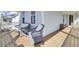 Relax on the porch with cushioned wicker chairs and enjoy the outdoors at 225 Bird Song Path, Summerville, SC 29485