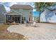 Backyard featuring a screened porch, patio area, and detached garage at 2270 Kemmerlin St, Johns Island, SC 29455