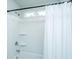 Bathroom shower with white tile and a white curtain with a window overhead at 2270 Kemmerlin St, Johns Island, SC 29455