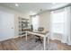 Well-lit home office featuring a desk, shelving unit, and neutral color palette at 2270 Kemmerlin St, Johns Island, SC 29455