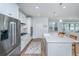Modern kitchen with stainless steel appliances, white cabinetry, and a spacious kitchen island at 2270 Kemmerlin St, Johns Island, SC 29455