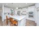 Well-lit modern kitchen boasts stainless steel appliances, a central island, and white cabinets at 2270 Kemmerlin St, Johns Island, SC 29455