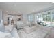 Open concept living room flows into kitchen area with access to a screened porch with outdoor seating at 2270 Kemmerlin St, Johns Island, SC 29455