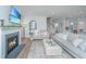 Comfortable living room with fireplace, television, adjacent staircase, and decor at 2270 Kemmerlin St, Johns Island, SC 29455