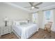 Bright main bedroom with a ceiling fan, rocking chair, and hardwood floors at 2270 Kemmerlin St, Johns Island, SC 29455