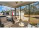 Screened-in patio with seating, a view of the backyard, and two detached garages at 2270 Kemmerlin St, Johns Island, SC 29455