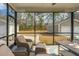 Comfortable screened-in patio overlooking the backyard and detached garages at 2270 Kemmerlin St, Johns Island, SC 29455
