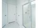 Modern shower with glass door and white marble style tile at 2270 Kemmerlin St, Johns Island, SC 29455