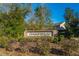Elegant community sign with lush landscaping, creating an inviting entrance to Oakfield at 2270 Kemmerlin St, Johns Island, SC 29455