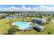 Community pool area with pool house, lush green spaces, and residential neighborhood at 232 Decatur Dr, Summerville, SC 29486
