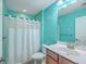 Bathroom featuring turquoise walls, a shower with curtain, and vanity with sink and mirror at 232 Decatur Dr, Summerville, SC 29486