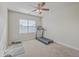 Neutral bedroom featuring a treadmill, fitness mat, weights, and a window with blinds at 232 Decatur Dr, Summerville, SC 29486