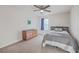 Bedroom with carpet, a bed with gray comforter, wooden dresser, and window with a blue curtain at 232 Decatur Dr, Summerville, SC 29486