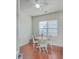 Dining room featuring a wooden table, white chairs, and a window with blinds at 232 Decatur Dr, Summerville, SC 29486