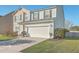 Charming two-story home featuring a well-manicured lawn and an attached two-car garage at 232 Decatur Dr, Summerville, SC 29486