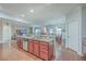 Kitchen island with granite countertop, sink, and wood cabinetry at 232 Decatur Dr, Summerville, SC 29486