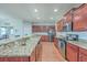 Kitchen with granite counters, stainless appliances, and wood cabinets at 232 Decatur Dr, Summerville, SC 29486