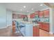 A kitchen with stainless steel appliances, a large island with granite countertops, and dark wood cabinets at 232 Decatur Dr, Summerville, SC 29486