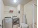Well-equipped laundry room with modern washer, dryer, and plenty of storage space at 232 Decatur Dr, Summerville, SC 29486