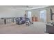 Well-lit living room with a couch, air hockey table, and a flatscreen television on the wall at 232 Decatur Dr, Summerville, SC 29486