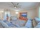 Comfortable living room with a large fan and a view to the dining and kitchen areas at 232 Decatur Dr, Summerville, SC 29486