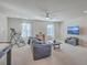 Bright living room with a comfortable couch, large windows, and a flatscreen television at 232 Decatur Dr, Summerville, SC 29486