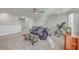 Spacious room with a ceiling fan, comfortable sofa, and a game table for relaxing and entertaining at 232 Decatur Dr, Summerville, SC 29486