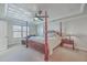 Charming bedroom with a four-poster bed, decorative ceiling, and ample natural light at 232 Decatur Dr, Summerville, SC 29486