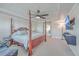 Bedroom featuring a stylish bed, tray ceiling, ceiling fan, and a mounted television at 232 Decatur Dr, Summerville, SC 29486