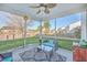 Outdoor patio with screened-in porch, overhead ceiling fan and furniture, and a lovely yard view at 232 Decatur Dr, Summerville, SC 29486